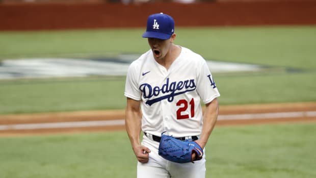 Oct 17, 2020; Arlington, Texas, USA; Los Angeles Dodgers starting pitcher Walker Buehler (21) reacts after a strike out in the sixth inning against the Atlanta Braves during game six of the 2020 NLCS at Globe Life Field. Mandatory Credit: Tim Heitman-USA TODAY Sports